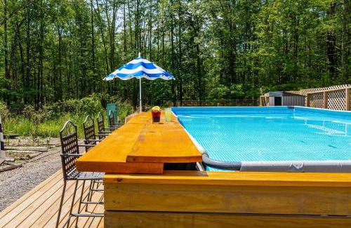 New Paltz House | PoolHot Tub Firepit Near Hikes Shops Dining Cragswood Lodge by AvantStay
