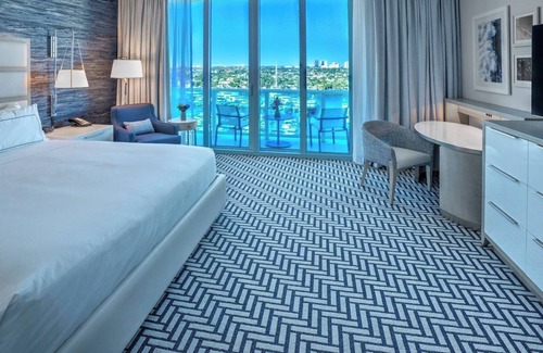 Central Beach Hotel | Poolside Paradise with Marina Balcony, Steps to Beach Place Entertainment