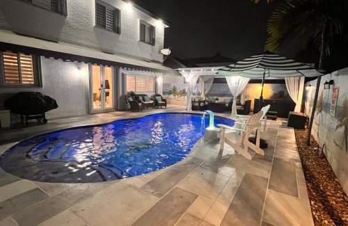 Country Walk House | PoolSide Vacation Home with Theater Gameroom