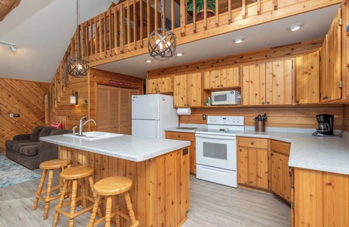 Eagle River House | Porch in the Pines | Lakefront home w/AC! Sandy Beach, Dock, Dogs OK