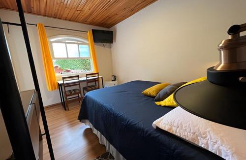 Jardim Nova Suica Cabin | Pousada Casinha Amarela - Campos do Jordão