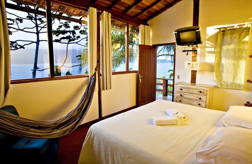 Veloso Hotel | Pousada Isola Bella - Sobre o Mar