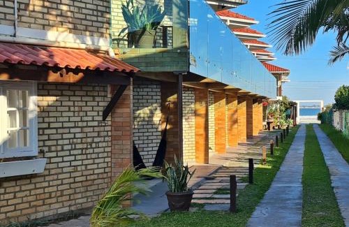 Ponta do Papagaio Hotel | Pousada Recanto Edênico - à beira mar da Praia Ponta do Papagaio, Palhoça SC