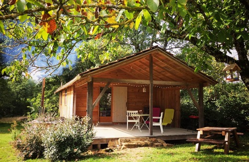 Espinas Cabin | Pretty cabin in beautiful gardens with wood stove & Nordic spa hot-tub/jacuzzi.