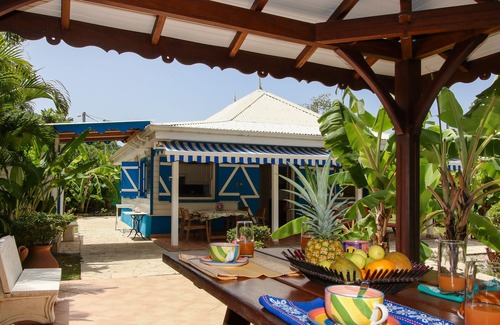 Sainte-Anne Villa | Pretty, old Creole villa with veranda, gazebo and floral garden.
