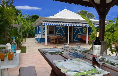 Sainte-Anne Villa | Pretty, old Creole villa with veranda, gazebo and floral garden.
