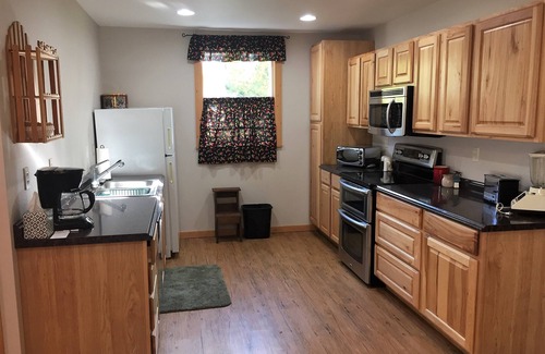 Big Arm House | Prime Lakefront home w/guest house - extra charge, dock, firepit, large yard