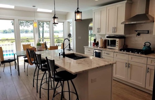 Mastic House | Private, 3-acre, waterfront escape w/pool, firepit, game rm & spectacular views