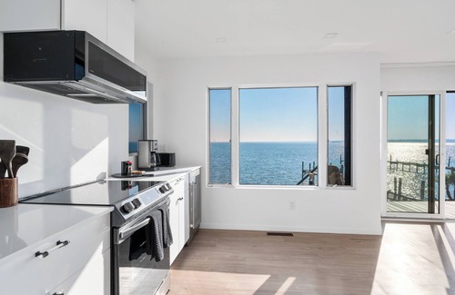 Hampton Bays House | Private beach on a fenced in property sunset views