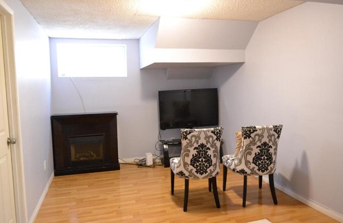 Southeast Calgary House | Private Bedroom in Basement - Erin Woods