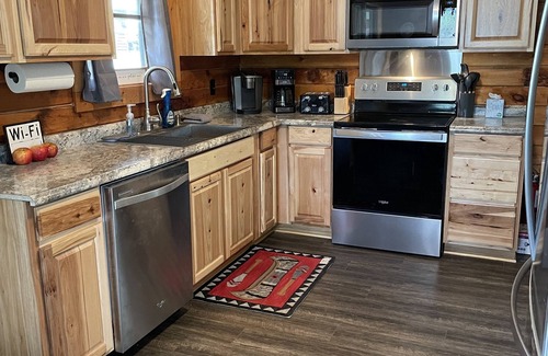McHenry Cabin | Private Dock, Hot Tub, Lakefront, Play Set, Large yard, Fire Pit, gas fireplace