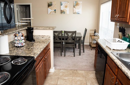 Barker House | Private Entry Cozy Townhome! w/ two car garage & close to airport!