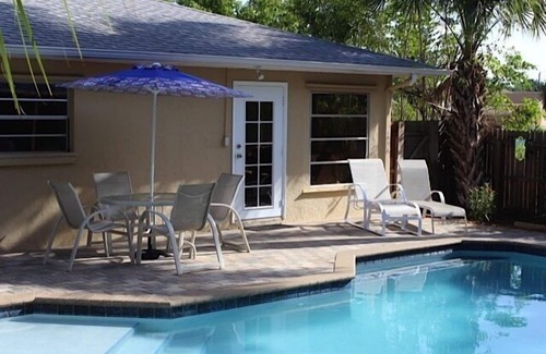 Naples Park House | Private, fenced-in pool, Morning Coffee on the porch and easy mile to the beach.
