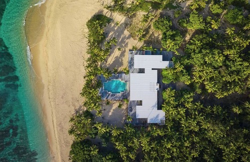 Yasawa Island House | Private Fijian Island. Concrete and Glass Modern Home. Come surf, sun and play