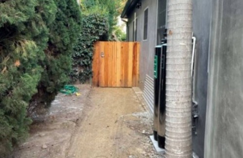 Sunset Park House | Private guesthouse with gated pathway entrance and private yard.