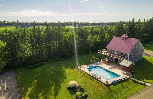 Stanley Bridge House | Private hot tub, secluded golf view villa. Pet Friendly!