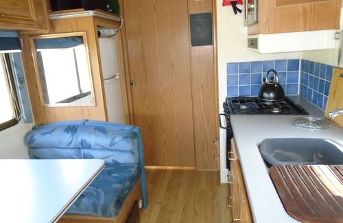 Ferrensby House | private hot tub with 1990,s American motorhome