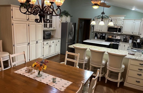 Vestaburg Cottage | Private lakefront home. Sandy beach canoe, 2 kayaks. Pool, Spa & Pontoon rental.