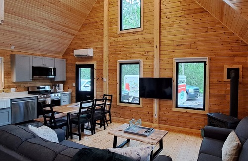 Antigonish County Cabin | Private lakefront log cabin with year-round hot tub.