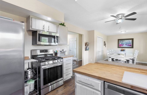 Huron House | Private ranch home with hot tub, playset, fire pit, and a nice lighted deck