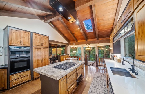 Oakhurst House | PRIVATE RESORT STYLE RIVERFRONT ESTATE W/TENNIS COURT, POOL, SPA, WATERFALLS.