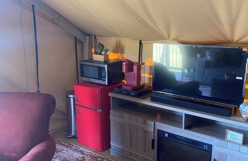 Miller Grove RV Rental | Private safari tent with ac/heat, Wifi and an exceptional view off a large deck.