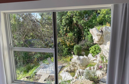 Woodhill Apartment | Private studio with your own waterfall garden and 5 minute walk to Hospital