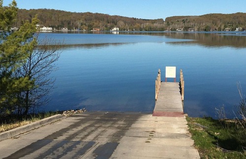 Petoskey Cottage | Quaint cottage with 2 separate homes and dock on the North Arm of Walloon Lake.