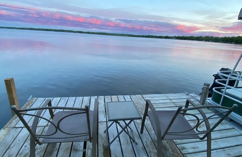 Carp Lake Cottage | Quaint Cottage with a Private Dock on Paradise Lake
