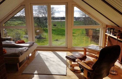 Gunneby House | Quaint, modern log cabin with barrel sauna, panoramic windows, Schlei view.