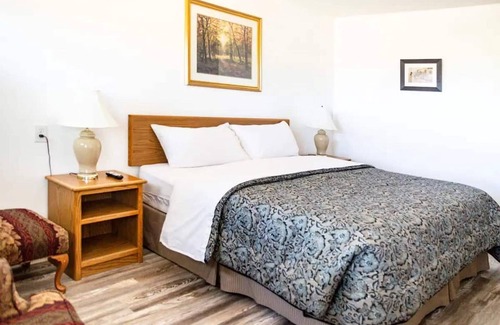 Delta Hotel | Quaint Single King Hotel Room overlooking the Gunnison River and your Private Patio! Perfect for fishing and exploring the outdoors.