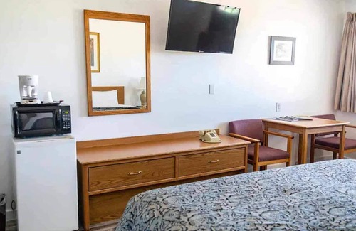Delta Hotel | Quaint Single King Hotel Room overlooking the Gunnison River and your Private Patio! Perfect for fishing and exploring the outdoors.