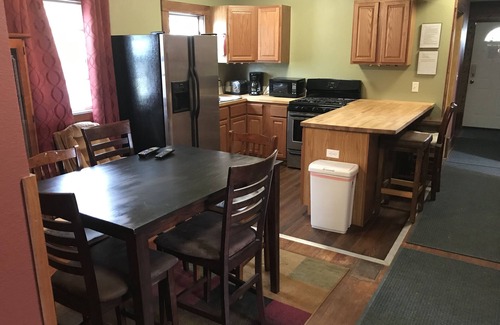 Superior House | Quaint Upstairs Apartment with peaceful treetop deck, close to downtown.