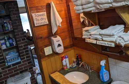 Nordland Cabin | Queen bed, coffee table with futon and beach view, door with beach access
