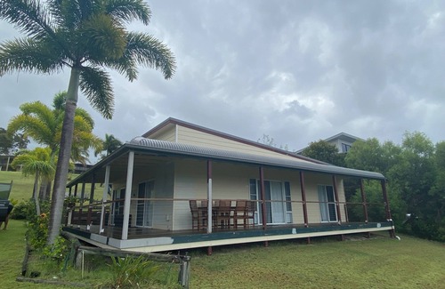 Orchid Beach House | Ques R & R at Orchid Beach. Water views with sea breeze. Relaxing Holiday House.