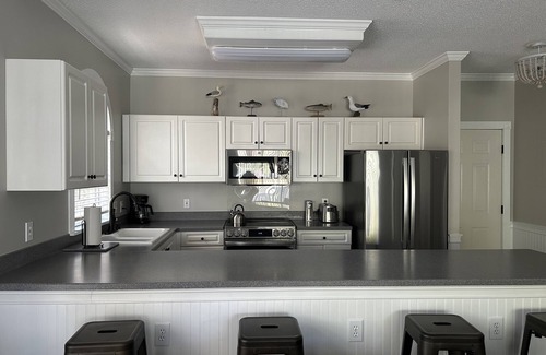 Arcadian Shores Condo | Quiet Beach Getaway