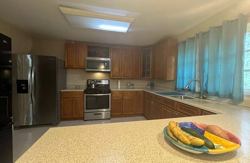 Bahamas Terrace House | Quiet getaway near Xanadu Beach, Freeport with Central Air, WiFi & free parking.
