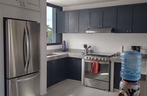 Colonia 10 De Abril Condo | Quiet PH in gated community with ocean views 1 minute walk from private beach