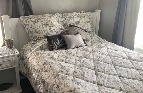 Cedar Rapids House | Quiet Relaxing bedroom with queen sized bed 2nd floor. Shared bathroom.