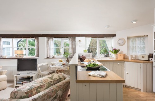 St Issey Cottage | Quirky home with romantic shepherds' hut bedrooms and pretty garden near Padstow