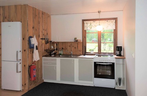 Holsbybrunn House | Red and white holiday home beautifully situated by the river Emån