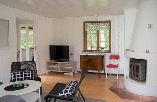 Holsbybrunn House | Red and white holiday home beautifully situated by the river Emån