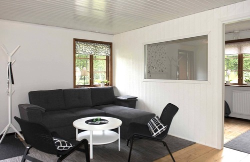 Holsbybrunn House | Red and white holiday home beautifully situated by the river Emån