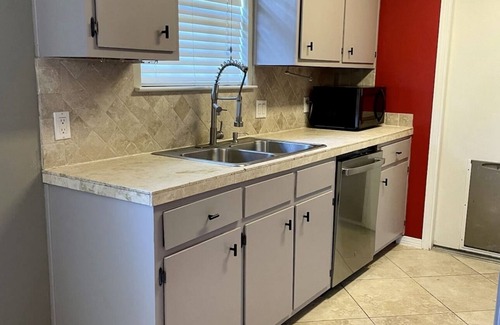 North Northwest Pensacola House | Red Door Bungalow-15 minutes to BEACH + Pet-Friendly!