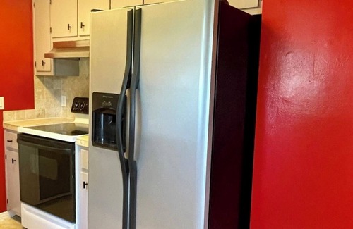 North Northwest Pensacola House | Red Door Bungalow-15 minutes to BEACH + Pet-Friendly!
