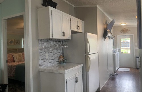Indian Harbor Estates House | Reel Paradise Cottage- Canal Front- Bring your Boat to our 50’ Dock!