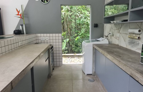 Guaratuba House | Refuge on Guaratuba beach, immersed in the Restinga de Bertioga State Park