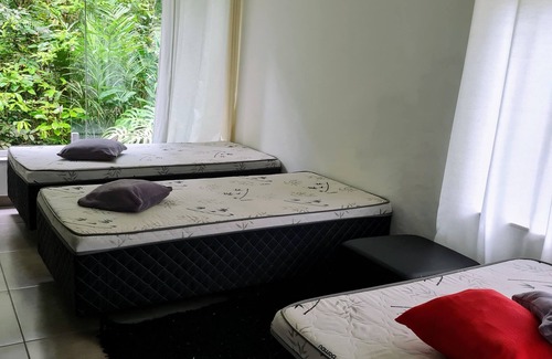 Guaratuba House | Refuge on Guaratuba beach, immersed in the Restinga de Bertioga State Park