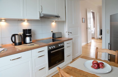 Cranz Apartment | Refurbished old building including tiled stove, double doors and direct water view