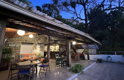 Vidigal Apartment | Relax and watch the sunrise across the ocean from your hammock. Views of Ipanema across the water